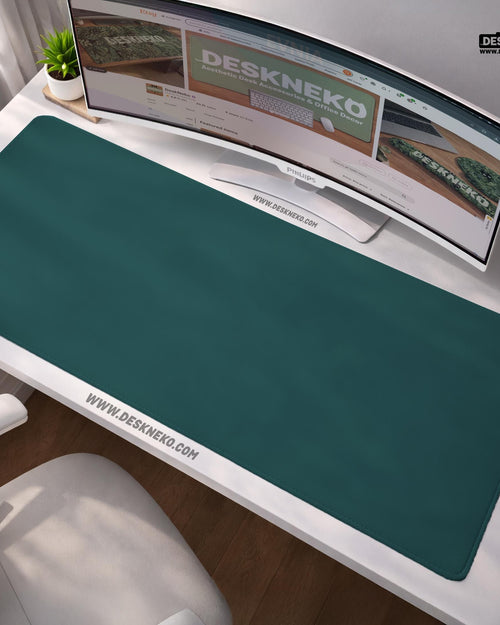 Muted teal solid color desk mat shown as a plain rectangular workspace pad.