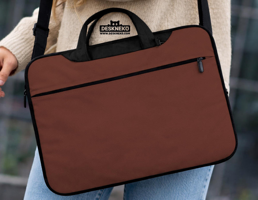 Brown laptop bag with a plain solid exterior, shown as a minimalist carrying case with handle and shoulder strap options.