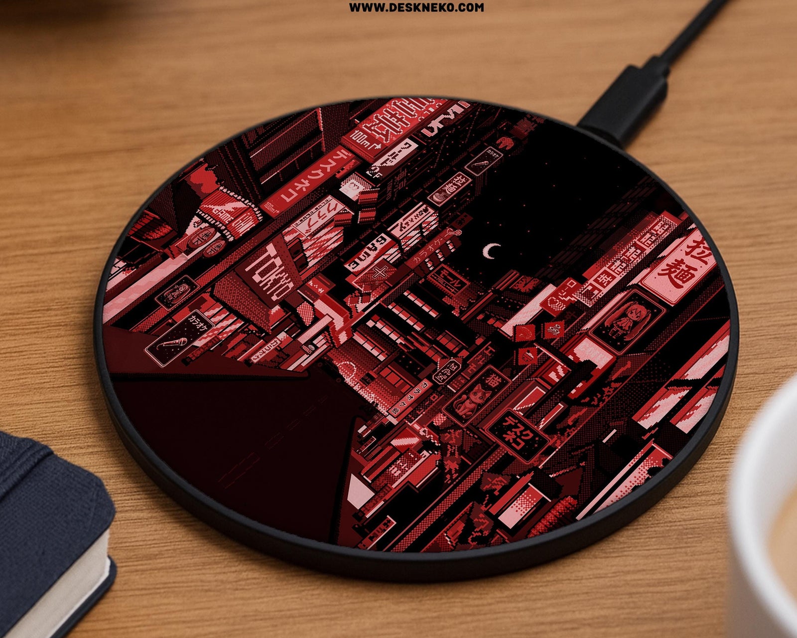 A round wireless charging pad with a red Tokyo neon street scene at night, glowing signage, pixel-style city details, a crescent moon, and a black and crimson color palette.