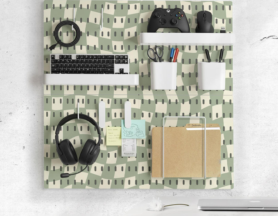 Black and white checkered pegboard wall organizer with panels, containers, shelves, clips, hooks, and a letter holder.