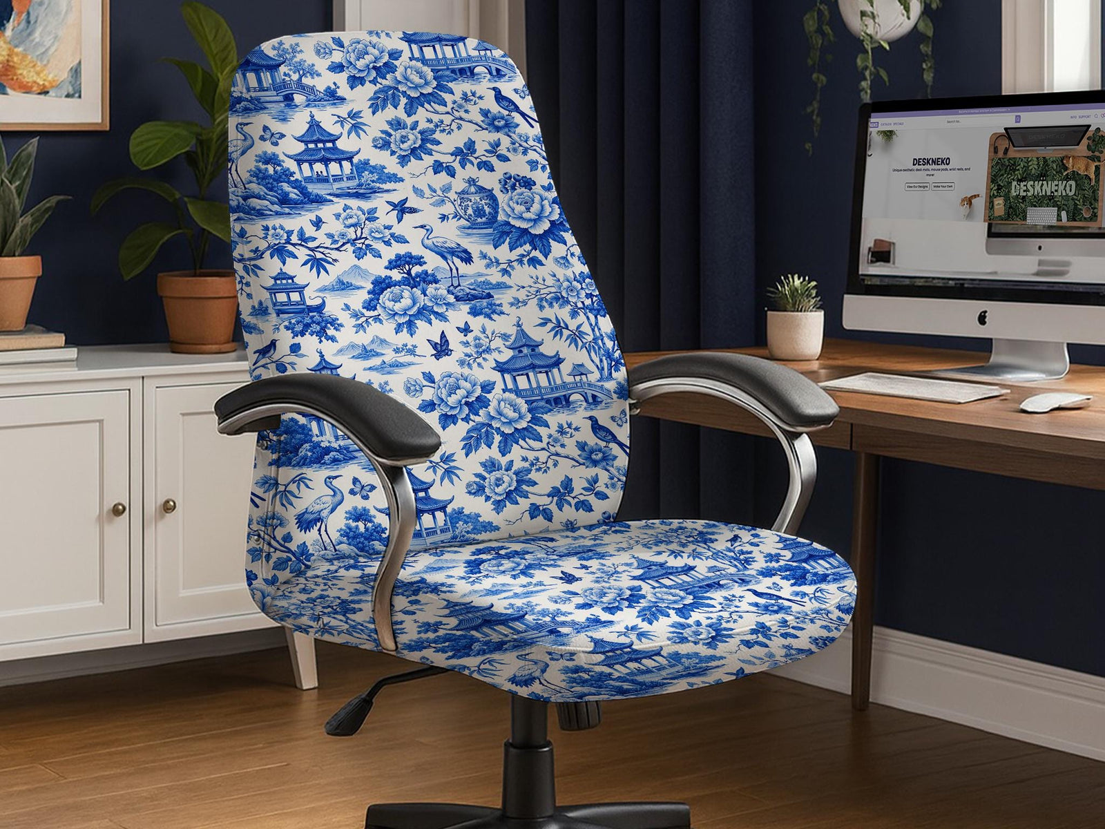 Office chair covered in a blue and white Asian garden pattern with pagodas, cranes, and floral motifs.