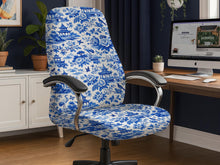Office chair covered in a blue and white Asian garden pattern with pagodas, cranes, and floral motifs.
