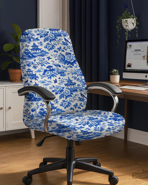 Office chair covered in a blue and white Asian garden pattern with pagodas, cranes, and floral motifs.