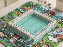Mint green square mahjong mat with a Japanese garden style border featuring cats, koi fish, bamboo, blossoms, and small scenic details.