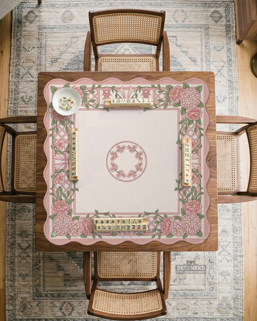 Pink mahjong mat with a floral bow design, peonies, hydrangeas, and a soft lattice border.