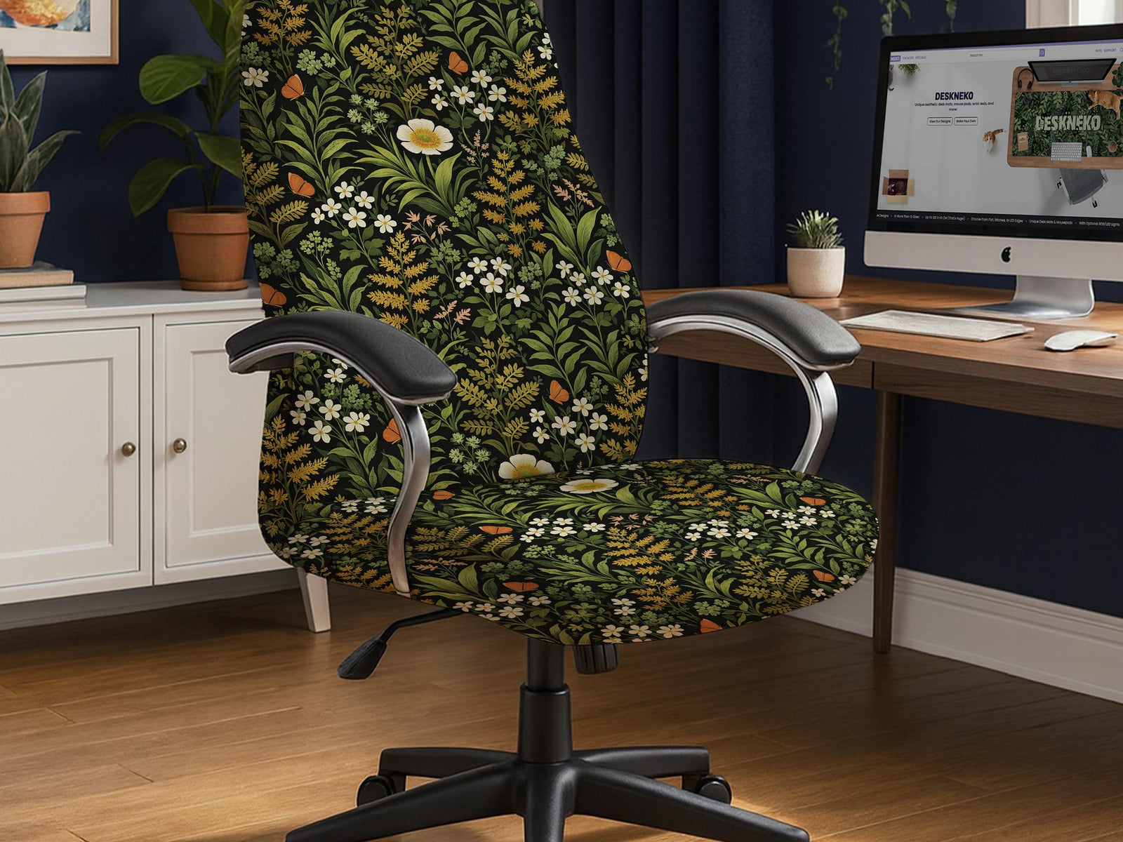 Office chair cover with a dark background, green leafy stems, white flowers, muted gold foliage, and small butterfly accents.