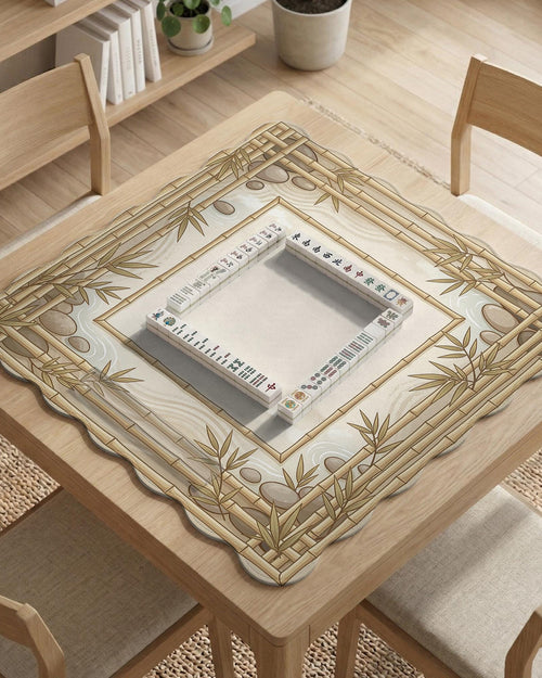 Square beige mahjong mat with bamboo frame details and botanical styling