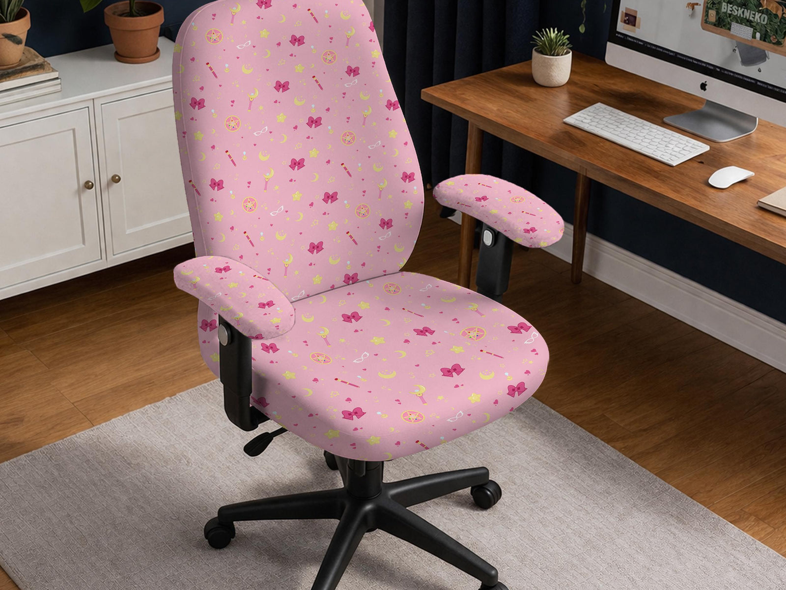 Pink office chair cover with a moon, star, bow, and wand print shown on a chair in a pastel-style setup.