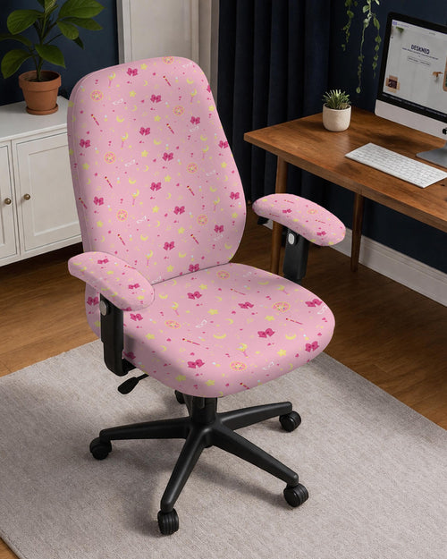 Pink office chair cover with a moon, star, bow, and wand print shown on a chair in a pastel-style setup.