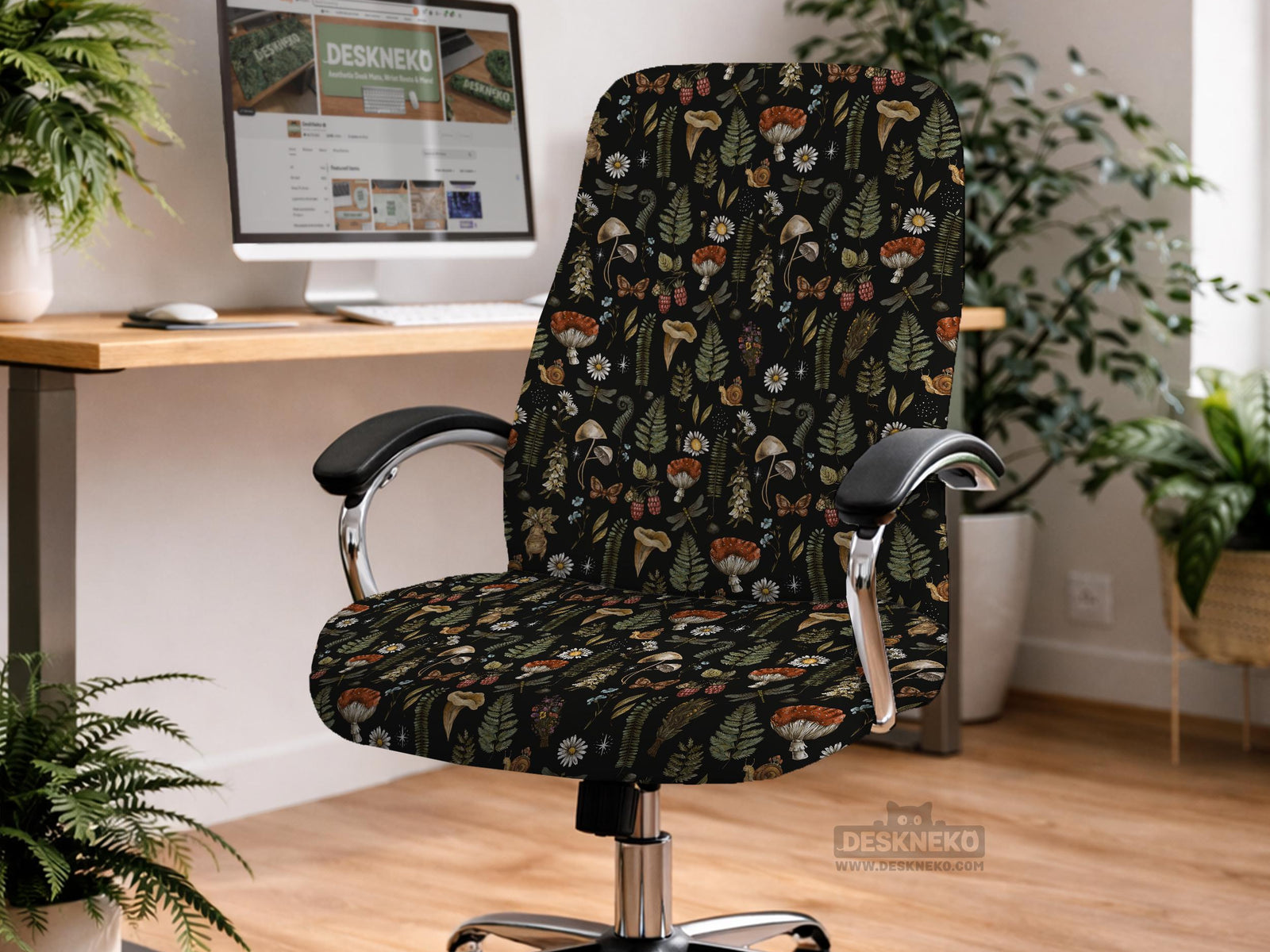 A black chair cover with a botanical print of mushrooms, ferns, daisies, berries, snails, and butterflies on a chair.