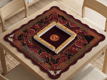 A square mahjong table mat with a red, black, and gold dragon design and an open center area.