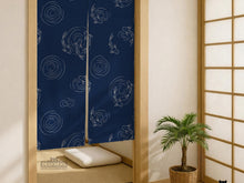 Navy blue noren door curtain with a koi fish pattern and flowing ripple line art on a light background.