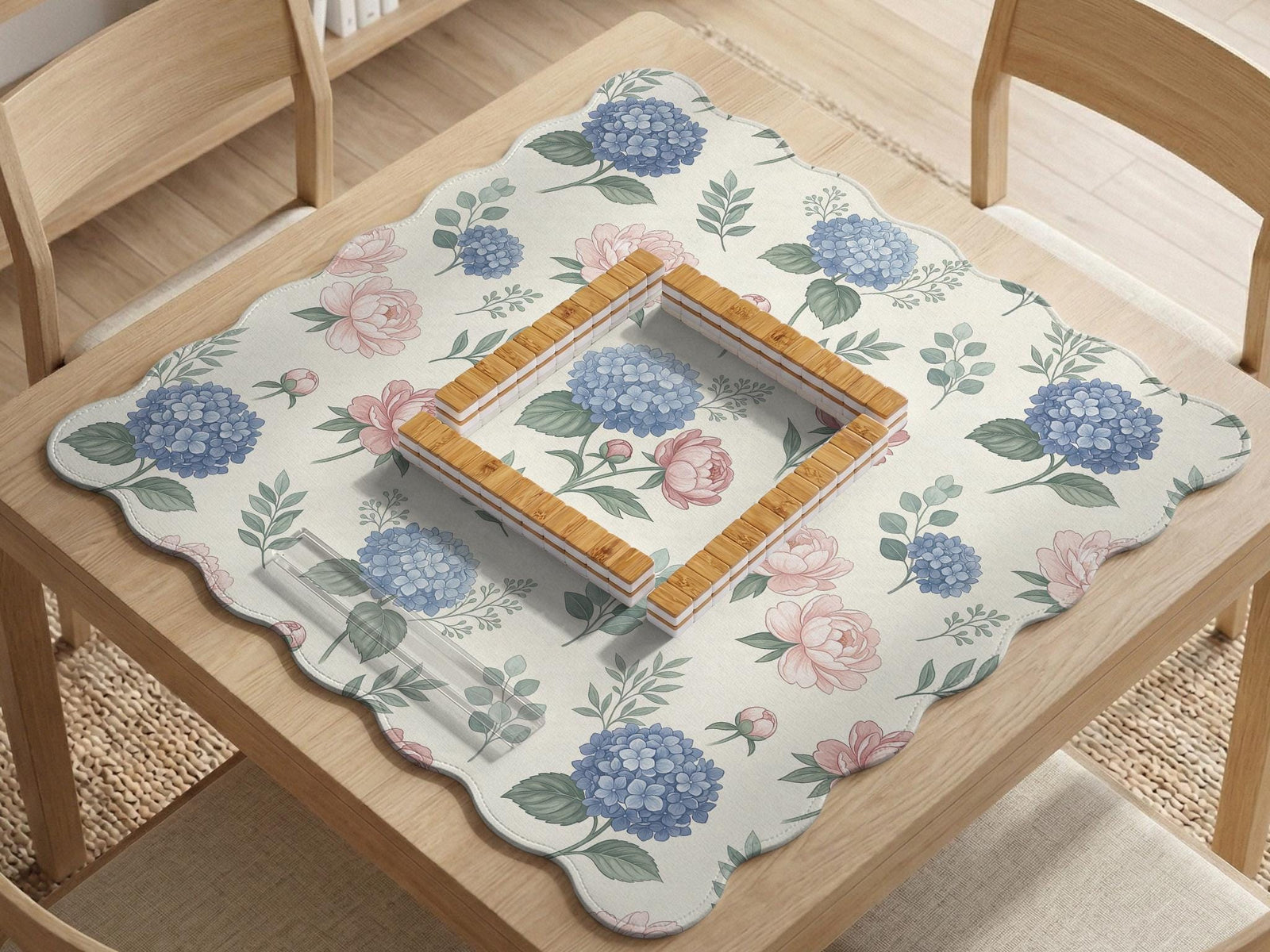 Square mahjong mat with a pink peony and blue hydrangea floral print on a light background.