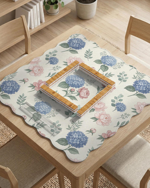 Square mahjong mat with a pink peony and blue hydrangea floral print on a light background.