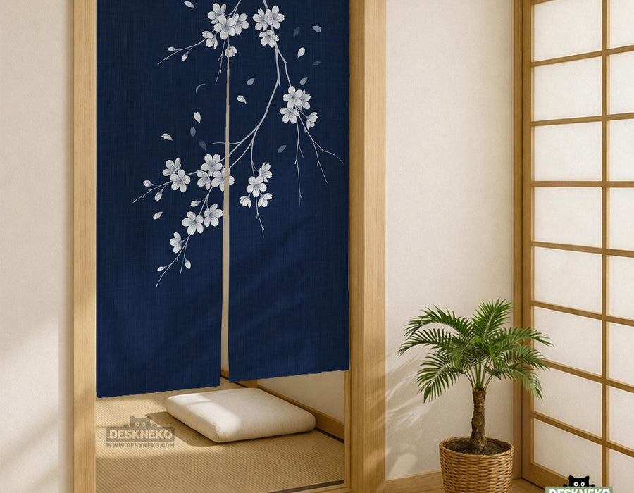 Navy door curtain with pink cherry blossom branches and a light floral layout on a dark background.