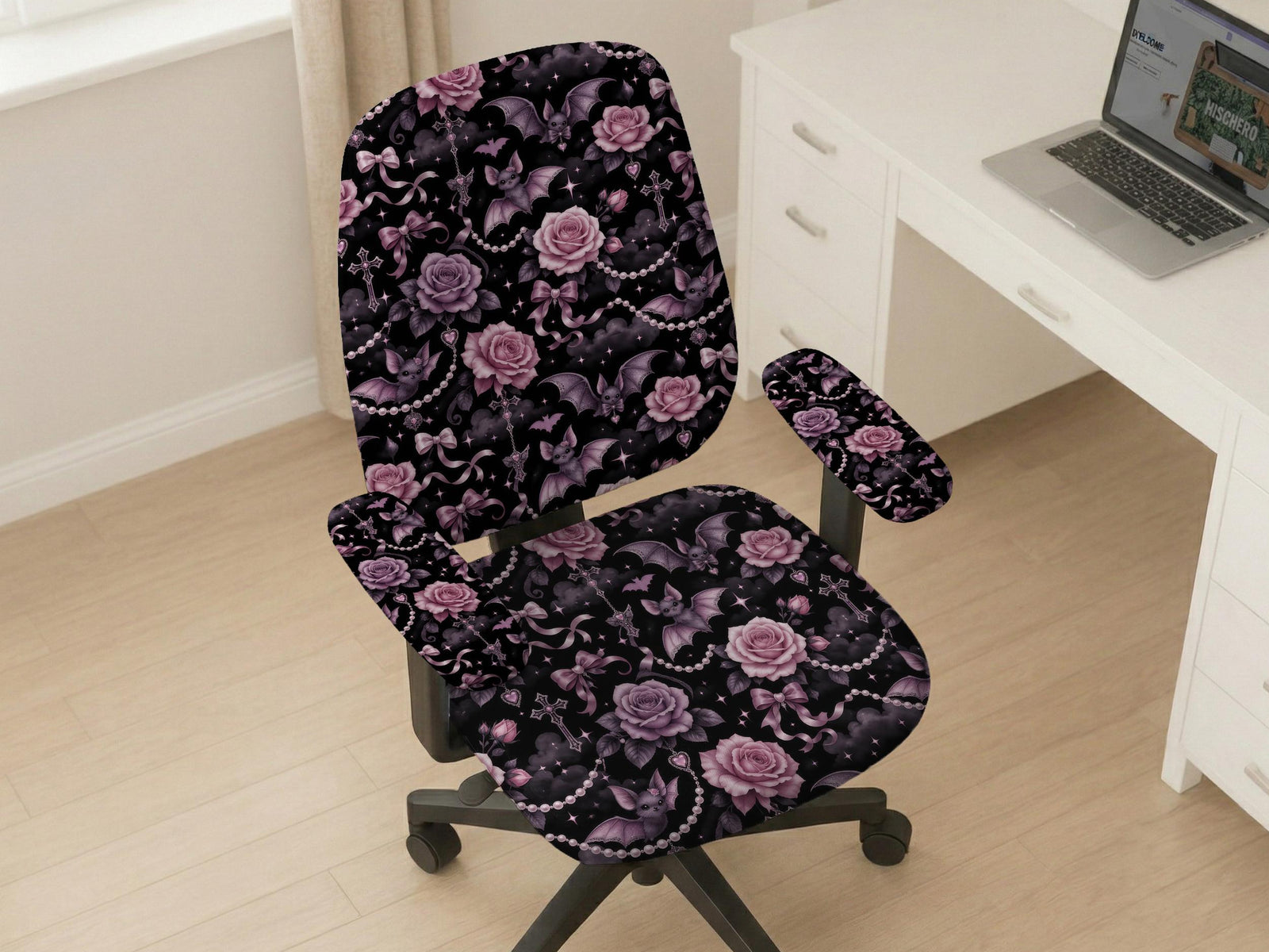Desk chair cover design with pink roses, small bats, moons, pearls, and ribbon details on a black background.
