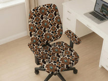 Office chair cover options in a western cowgirl cow print design with cream contrast, dark floral shapes, and turquoise accents.