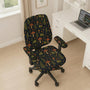Desk chair cover with a dark forest print of frogs, mushrooms, and ferns in green and brown tones.