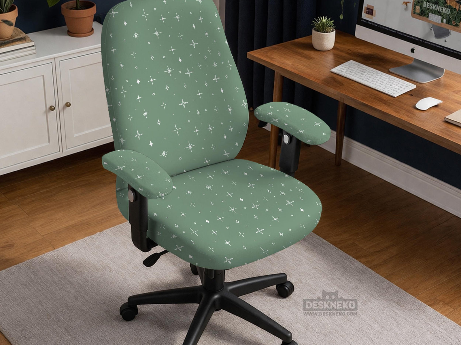 A sage green desk chair cover with a small white star pattern shown on a chair.
