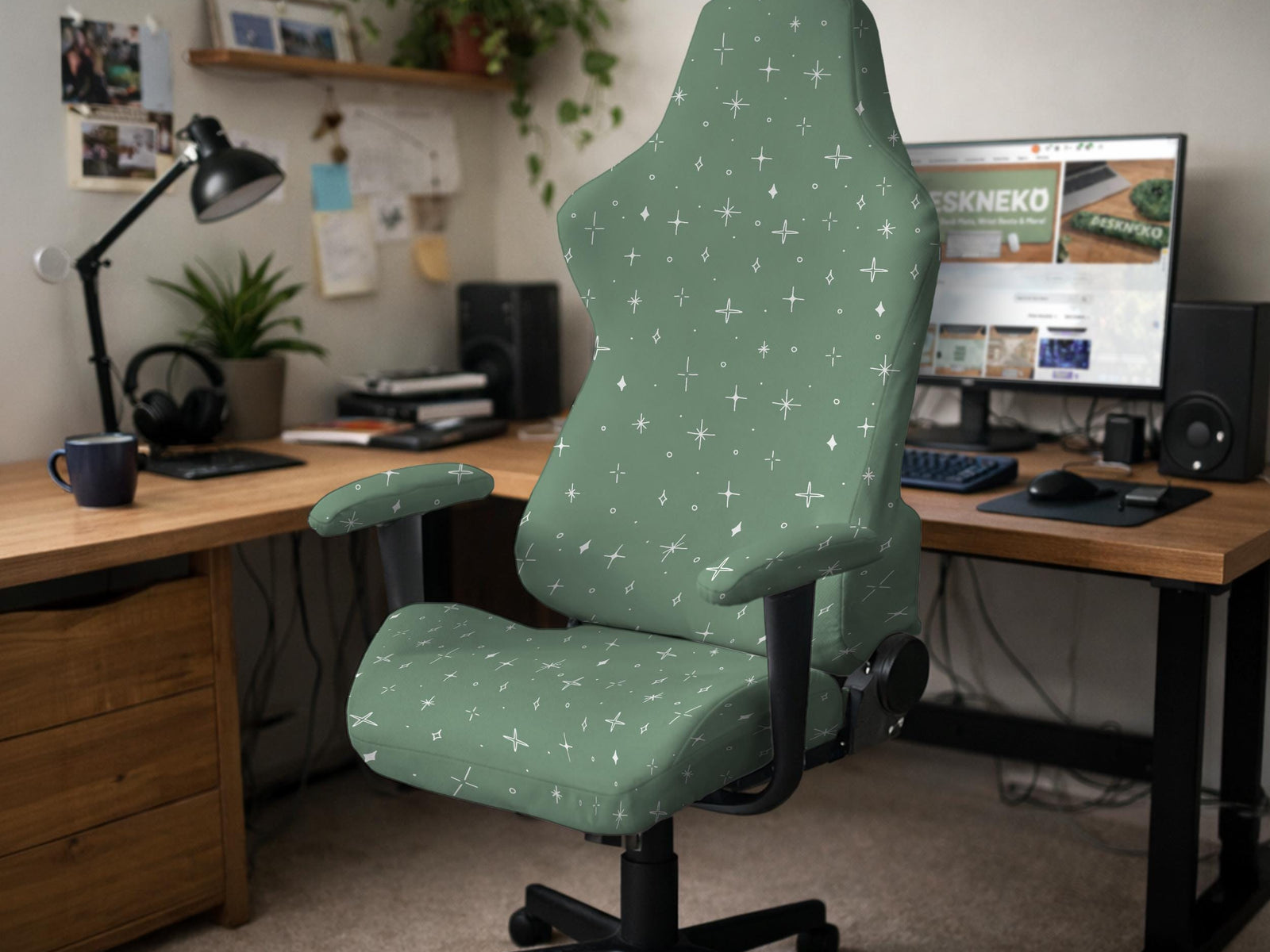 A sage green chair cover with a small white star pattern shown on a high back office or gaming chair.