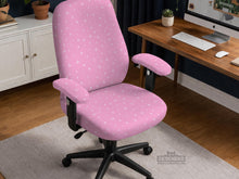 Pink chair cover with a small white star pattern shown on a desk chair.