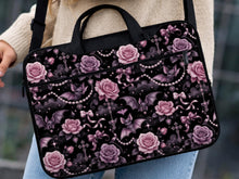 Pink laptop bag and sleeve design with small black bats, pink roses, pearl garlands, bows, and clouds on a black background.