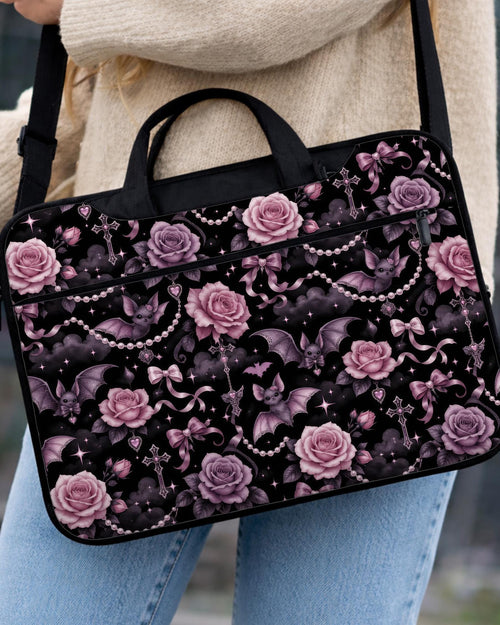 Pink laptop bag and sleeve design with small black bats, pink roses, pearl garlands, bows, and clouds on a black background.
