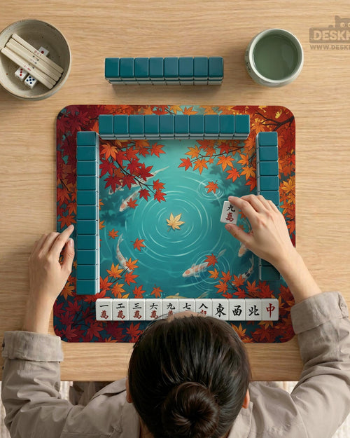 Square teal mahjong mat with a koi pond scene, orange koi fish, and autumn maple leaves around a decorative border.