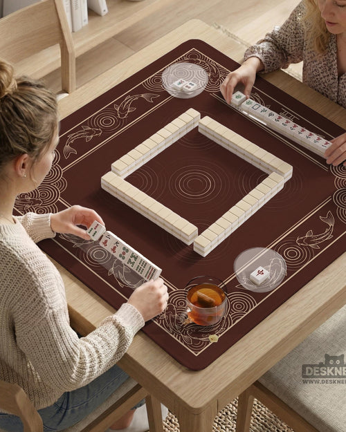 Square brown mahjong table mat with a koi fish border, wave details around the edges, and an open center area.