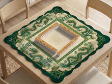 A scalloped mahjong mat with jade green dragon artwork, a bamboo border, and a cream center.