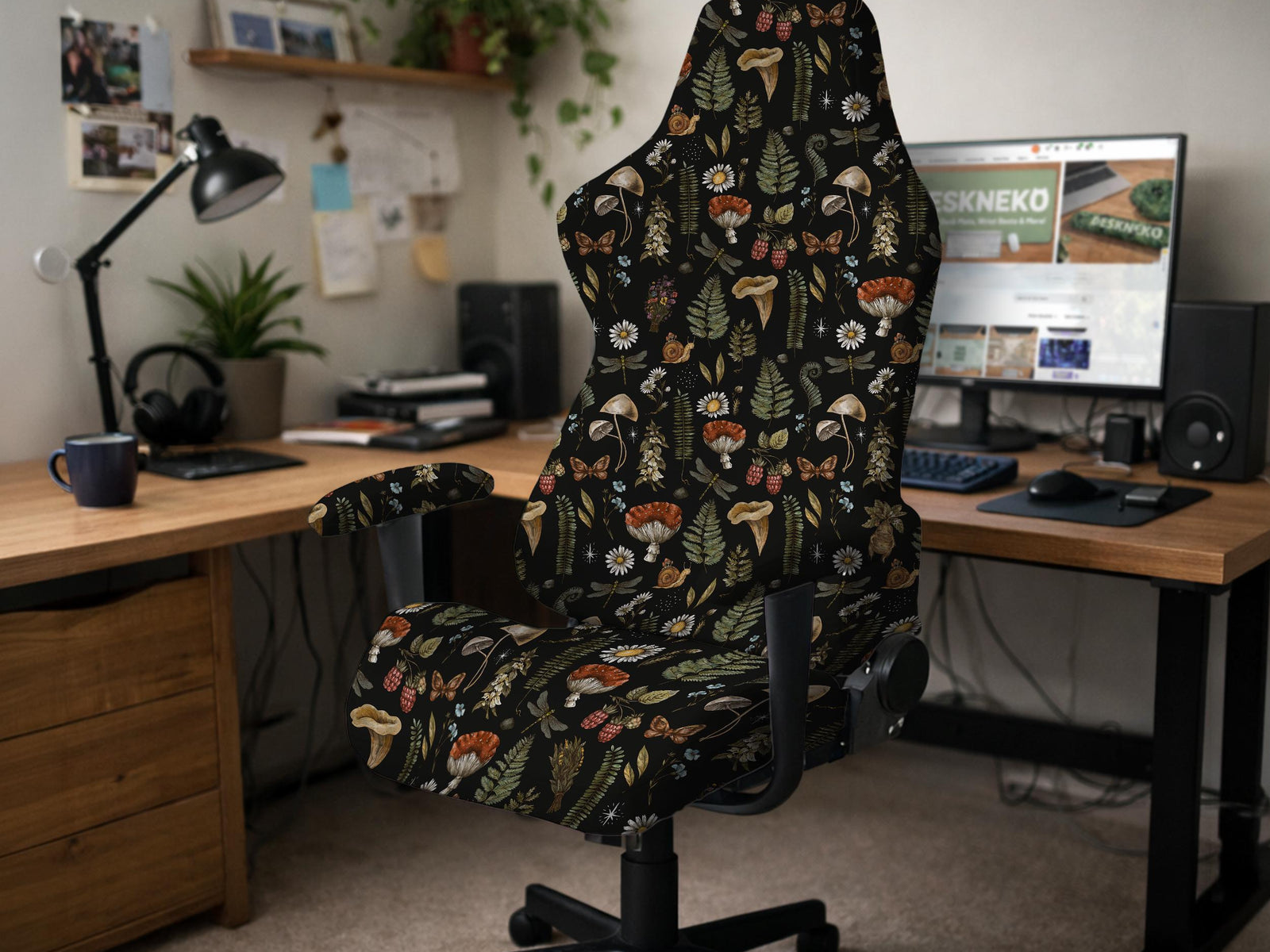 Black chair cover with a mushroom and fern botanical print in dark green and brown tones.