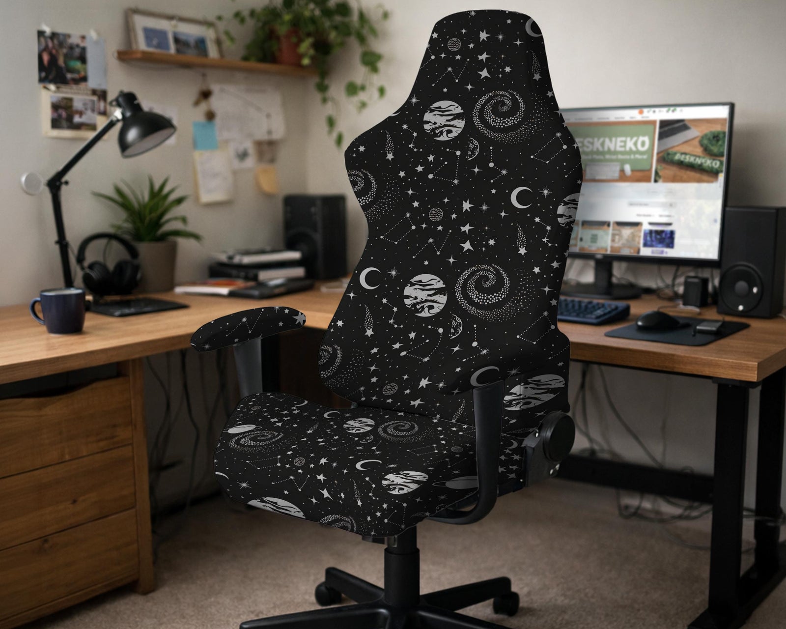 Black chair cover with a celestial galaxy print featuring stars, moons, planets, and constellations.