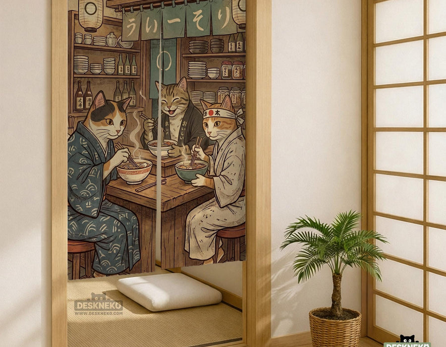 A split-panel Japanese noren curtain showing a ramen shop scene with three cats, warm lantern light, and vintage-style artwork in beige, muted teal, and brown tones.