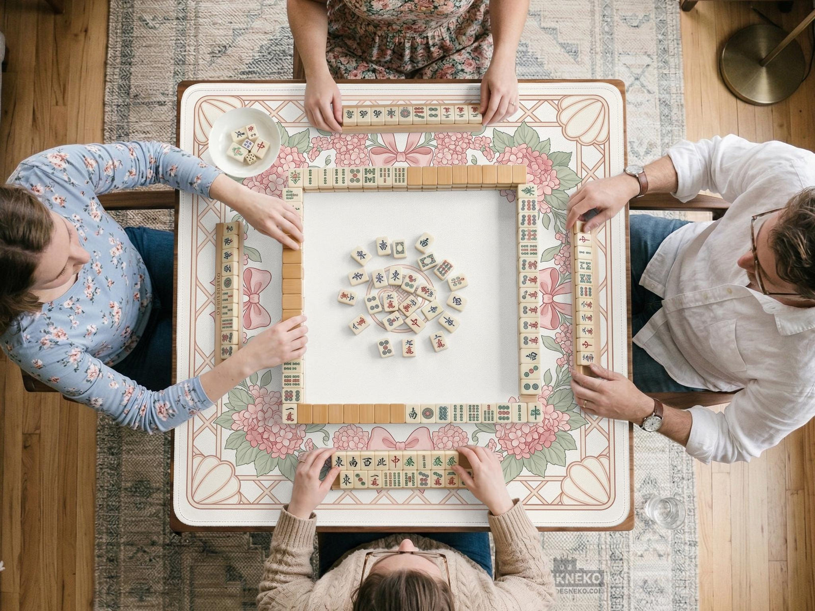 Square pink mahjong mat with hydrangea flowers, bows, a cream and sage floral border, and a blank center play area.