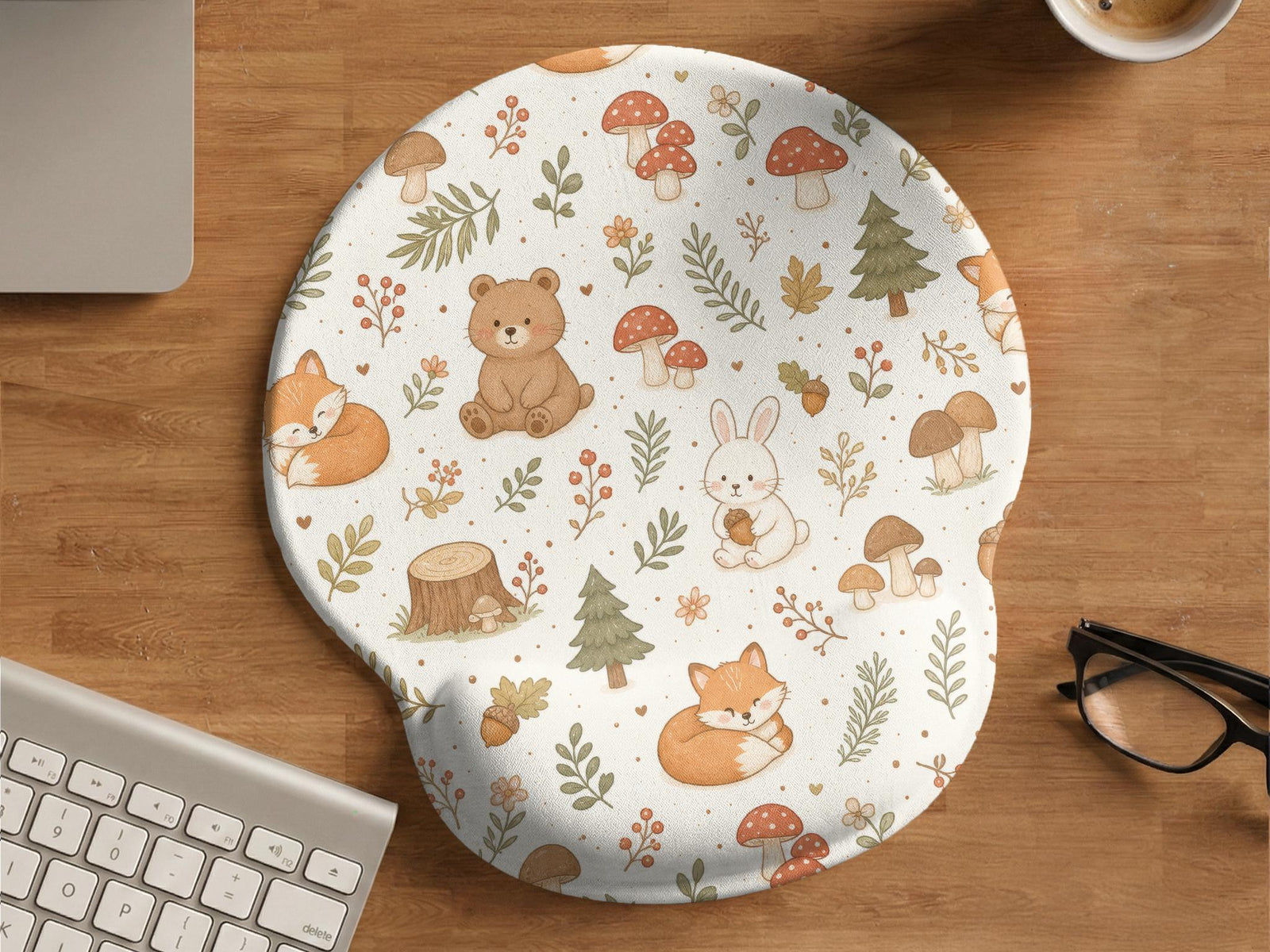 Cream mouse pad and keyboard wrist rest with a cottagecore forest animal pattern including foxes, bears, bunnies, mushrooms, and leafy branches.
