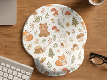 Cream mouse pad and keyboard wrist rest with a cottagecore forest animal pattern including foxes, bears, bunnies, mushrooms, and leafy branches.