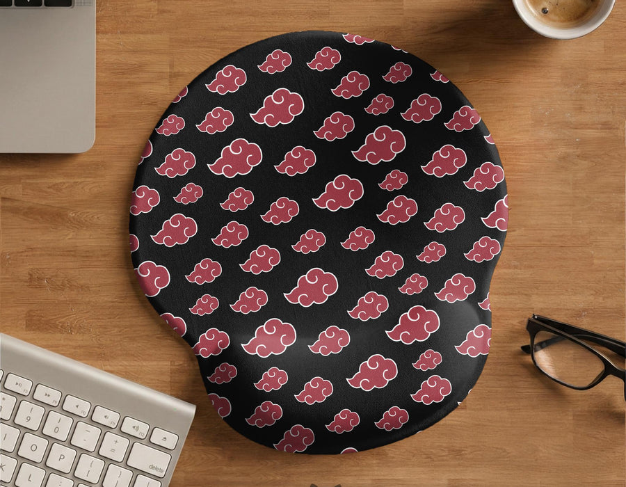 Black mouse pad with a red cloud pattern and matching keyboard wrist rest option shown as desk accessories.