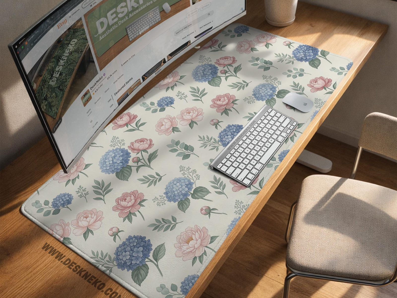 Floral desk mat with sage greenery, pink peonies, blue flowers, and a warm cream background.