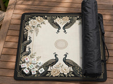 Cream mahjong table mat with a chinoiserie floral border, dark peacocks, soft gold linework, and an open center area.