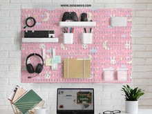 Pink pegboard panels with a kawaii bunny, cloud, moon, bow, and star pattern shown as a wall organizer set.