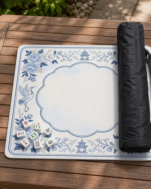 Blue mahjong mat with a chinoiserie-style floral pattern and decorative border.