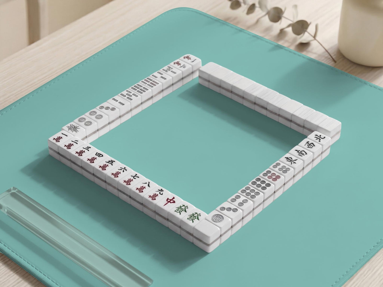 Solid aqua square mahjong mat with a scalloped edge.