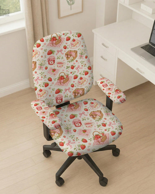 Desk chair cover with a cream background, red strawberries, pink gingham, bows, picnic baskets, flowers, jam jars, and teacups.