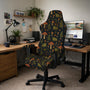 A gaming chair cover with a dark woodland pattern showing frogs, mushrooms, and ferns in earthy green and brown tones.