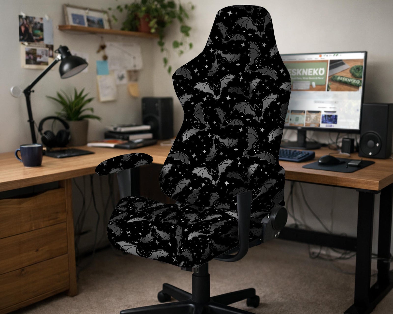 Black chair cover with a bat and star pattern shown on a gaming chair, with multiple cover style options listed for full chair, back and seat, seat only, and armrests.