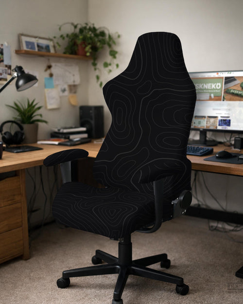Black chair cover with a thin line art pattern on a gaming chair, shown with a high back and armrest areas covered.