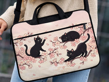 Black laptop bag and sleeve with a sakura and black cat print, shown with handle and shoulder strap options and multiple size selections.