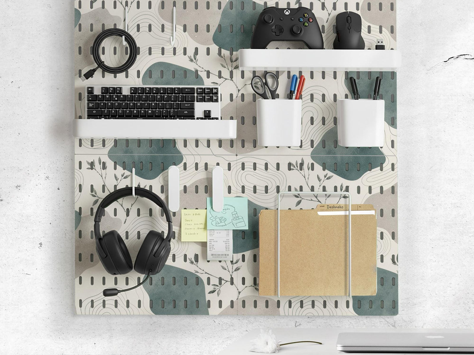 Four pegboard panels in sage green with cream, grey, teal, and leafy botanical artwork arranged in a square layout.