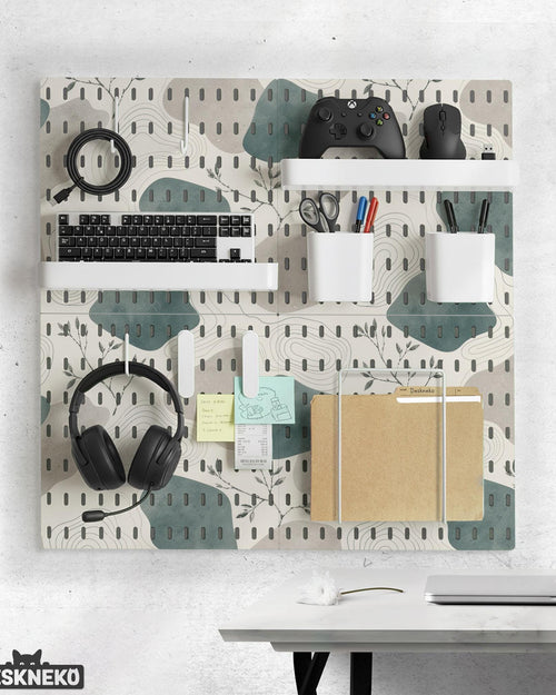Four pegboard panels in sage green with cream, grey, teal, and leafy botanical artwork arranged in a square layout.