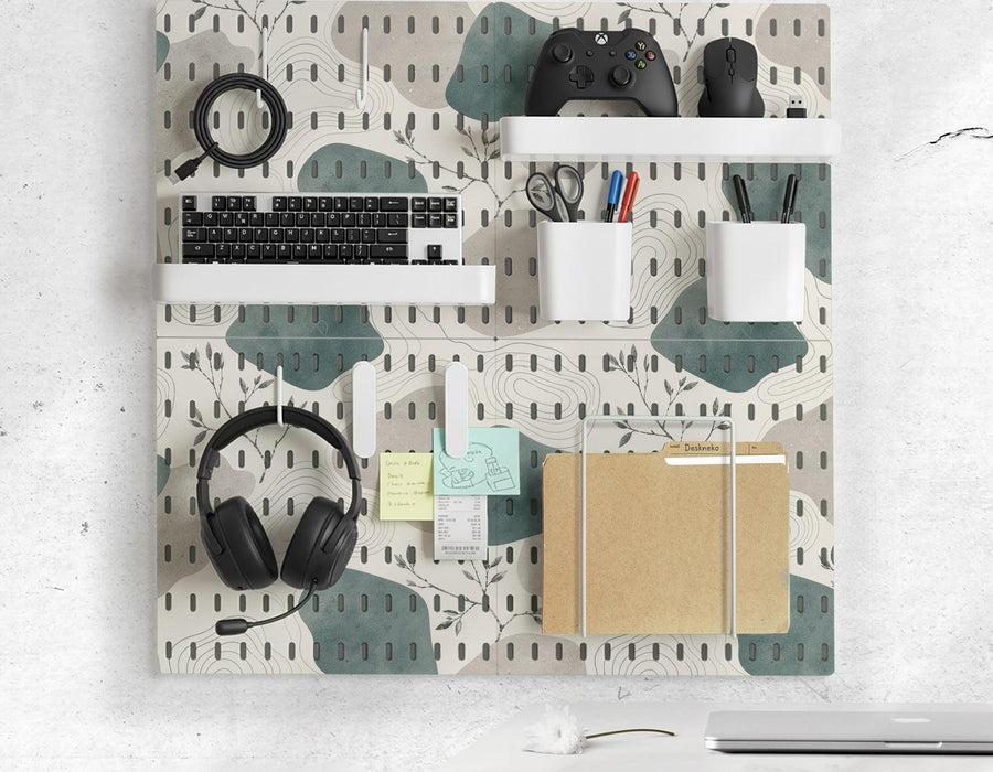 Four pegboard panels in sage green with cream, grey, teal, and leafy botanical artwork arranged in a square layout.